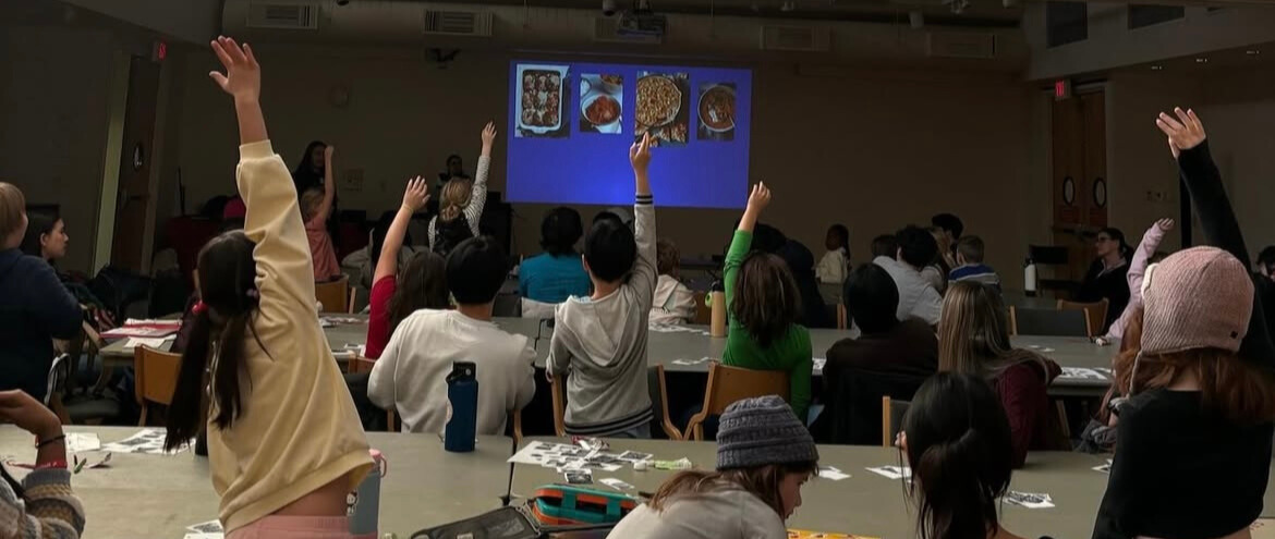 Girls making letters with their arms